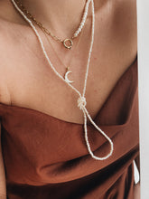 Long pearl necklace
