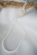 Long pearl necklace
