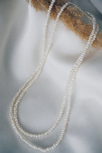 Long pearl necklace